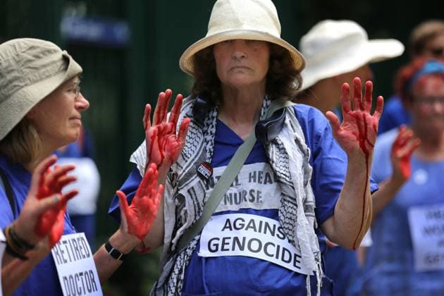 News Themen der Woche KW27 Bilder des Jahres 2025, News 06 Juni News Bilder des Tages June 30, 2025, London, England, UK: Supporters from Defend Our Juries from the medical profession hold up their red hands at the court entrance in support of the Filton 18. Protesters stand outside Woolwich Crown Court demanding justice for the Filton 18 as they appear in court to determine what legal defences apply for the group. Eighteen Palestine Action activists are currently being held on remand following an action at Elbit SystemÃ¢â‚¬â ¢s Filton facility in Bristol in August 2024. The activists were arrested under the Terrorism Act that allowed the police special measures including keeping those arrested to be held in solitary confinement for up to a week. Their charges are not terrorist related and they have been accused of causing o - ZUMAmp3_ 20250630_zip_mp3_018 Copyright: xMartinxPopex