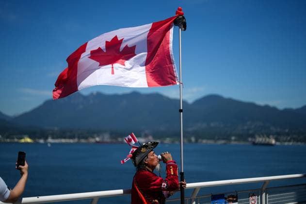 July 1, 2025, Vancouver, Bc, CANADA: Dressed as a patriotic pirate, Hobes Hernandez Osorto, drinks a Molson Canadian beer while holding a Canadian flag during Canada Day festivities, in Vancouver, on Tuesday, July 1, 2025. Vancouver CANADA - ZUMAc35_ 20250701_zaf_c35_096 Copyright: xDarrylxDyckx