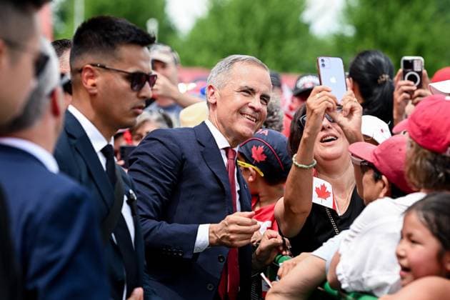 July 1, 2025, Ottawa, On, Canada: Prime Minister Mark Carney takes a selfie with a spectator following mid-day Canada Day celebrations at LeBreton Flats in Ottawa, on Tuesday, July 1, 2025. Ottawa Canada  - ZUMAc35_ 20250701_zaf_c35_125 Copyright: xSpencerxColbyx