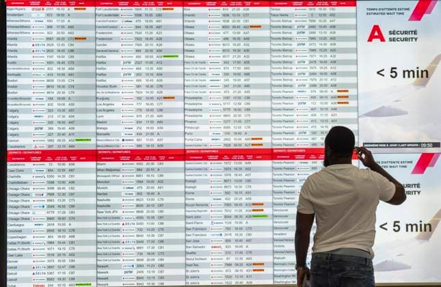 July 3, 2025, Dorval, Pq, CANADA: Nav Canada says early morning bomb threats affected airports in Ottawa, Montreal, Edmonton, Winnipeg, Calgary and Vancouver on Thursday. A traveller looks at the departure board at Montreal-Trudeau International Airport in Dorval, Que., on Thursday, July 3, 2025. Dorval CANADA - ZUMAc35_ 20250703_zaf_c35_009 Copyright: xChristinnexMuschix