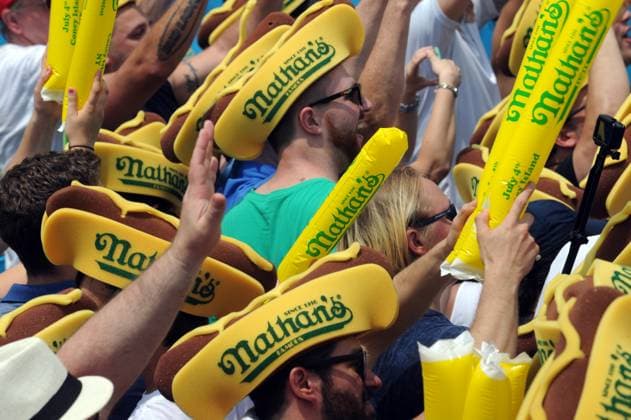 NEW YORK, NY - JULY 04: Competitive eaters Joey Chestnut breaks world record, downs 74 hot dogs to win the 2018 Nathans Famous 4th Of July International Hot Dog Eating Contest with 72 hot dogs at Coney Island on July 4, 2017 in the Brooklyn borough of New York City...People: Joey Chestnut Brooklyn Borough Of New York Cit United States Of America  - ZUMAs214 20180705_aba_s214_009 Copyright: xSMGx