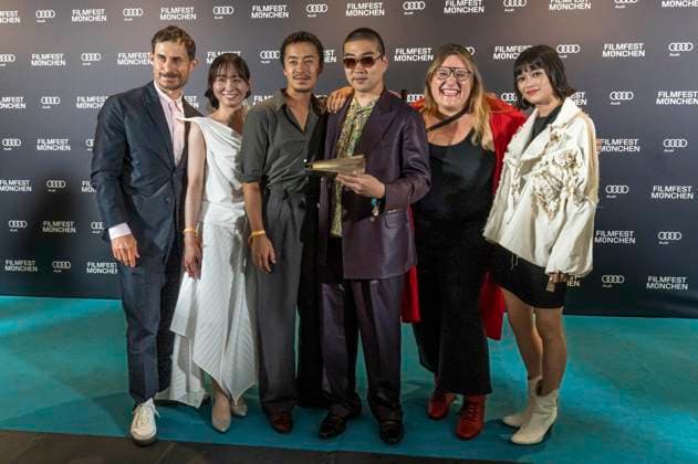 Clemens Schick , Soujiro Sanada with team and Anna Hints at the award ceremony at the 42 Filmfest München 2025 in the Amerikahaus Munich, 05 07 2025 Foto:xN.xKolinzx xFuturexImagex preisverleihung_5718