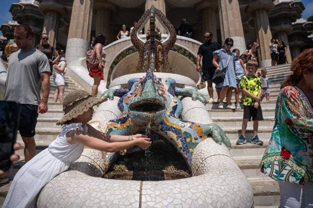 Overtourism At Park Guell In Barcelona. Tourists stroll through Park Guell and take pictures with Antoni Gaudi s architecture and the famous Park Guell Lizard during a hot morning in Barcelona, Spain, on July 6, 2025. The Catalan capital receives 20.37 million tourists annually, equivalent to a density of 201,722 visitors per square kilometer, making Barcelona the most crowded and tourist-filled city in the world. Barcelona Spain  Copyright: xMarcxAsensiox originalFilename: asensioclupes-overtour250706_npVHi.jpg