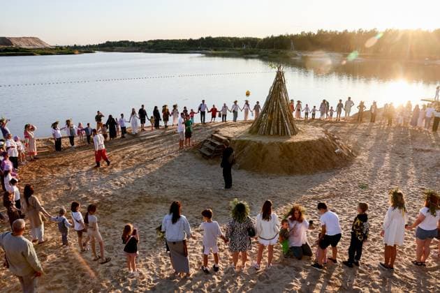 RUSSIA, RYAZAN REGION - JULY 5, 2025: People dance around a bonfire during a celebration marking Ivan Kupala Day at Akvamarin Holiday Centre. Alexander Ryumin TASS  82265239
