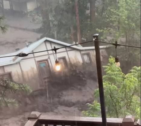 New Mexico Flooding, In this image taken from video, a house is carried away by flash flooding behind a house in Ruidoso, N.M., Tuesday, July 8, 2025. (Kaitlyn Carpenter via AP) BEST QUALITY. IMAGE TAKEN FROM VIDEO. AP PROVIDES ACCESS TO THIS THIRD PARTY PHOTO SOLELY TO ILLUSTRATE NEWS REPORTING OR COMMENTARY ON FACTS DEPICTED IN IMAGE; MUST BE USED WITHIN 14 DAYS FROM TRANSMISSION; NO ARCHIVING; NO LICENSING; MANDATORY CREDIT Ruidoso NM USA  Copyright: xKaitlynxCarpenterx 20250709171072473719