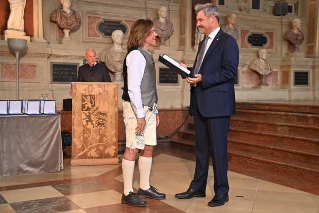 Juergen DREWS Saenger, musician receives the Bavarian Order of Merit from Markus SOEDER, State Premier of Bavaria and CSU Chairman Award of the Bavarian Order of Merit in the Antiquariat of the Residence in Munich on 09 07 2025