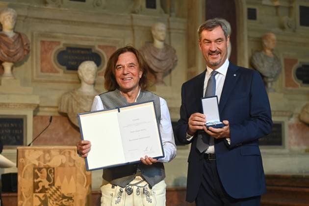 Juergen DREWS Saenger, musician receives the Bavarian Order of Merit from Markus SOEDER, State Premier of Bavaria and CSU Chairman Award of the Bavarian Order of Merit in the Antiquariat of the Residence in Munich on 09 07 2025