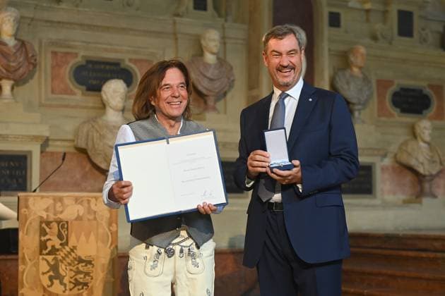 Juergen DREWS Saenger, musician receives the Bavarian Order of Merit from Markus SOEDER, State Premier of Bavaria and CSU Chairman Award of the Bavarian Order of Merit in the Antiquariat of the Residence in Munich on 09 07 2025