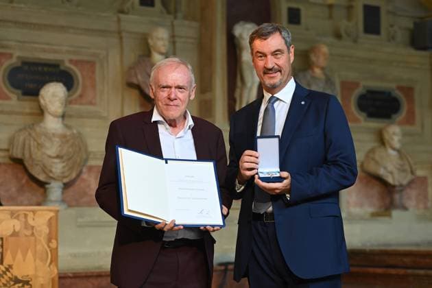 Hermann GERLAND receives the Bavarian Order of Merit from Markus SOEDER State Premier of Bavaria and CSU Chairman Bavarian Order of Merit Award Ceremony in the Antiquariat of the Residence in Munich on 09 07 2025