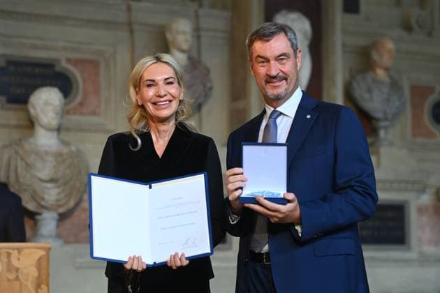 Saskia GREIPL KOSTANTINIDIS receives the Bavarian Order of Merit from Markus SOEDER, State Premier of Bavaria and CSU Chairman Award of the Bavarian Order of Merit in the Antiquariat of the Residence in Munich on 09 07 2025