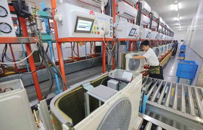 ANQING, CHINA - JULY 11: Employees work on the production line of air conditioners at a workshop of Anhui Boyang Refrigeration Equipment Co., Ltd. on July 11, 2025 in Anqing, Anhui Province of China.  Copyright: xVCGx 111579029849