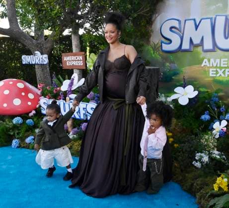 Rihanna, the voice of Smurfette in the animated musical comedy Smurfs and her sons Riot Rose Mayers (L) and RZA Athelston Mayers attend the premiere of the motion picture at Paramount Studios in Los Angeles on Sunday, July 13, 2025. Storyline: When Papa Smurf (John Goodman) is mysteriously taken by evil wizards, Razamel and Gargamel, Smurfette (Rihanna) leads the Smurfs on a mission into the real world to save him. With the help of new friends, the Smurfs must discover what defines their destiny to save the universe.  LAP2025071308 JIMxRUYMEN