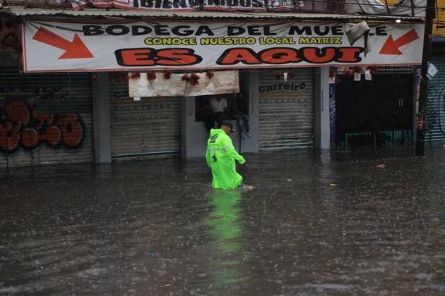 A traffic officer walks on the flooded Ignacio Zaragoza road in the Iztapalapa borough, after the storm that affected the east of the city due to heavy rains, leaving traffic disruptions for several hours. on July 15, 2025 in Mexico City, Mexico. Mexico City Mexico - ZUMAe321 20250715_zia_e321_044 Copyright: xIanxRoblesx