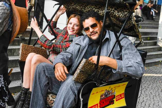 abb Jella Haase and Yasin Harrouk actors sit in the bicycle rickshaw as guests at the premiere of the film SchwarzeSchafe at the cinema in the Kultur Brauerei on July 15, 2025 in Berlin Berlin Germany