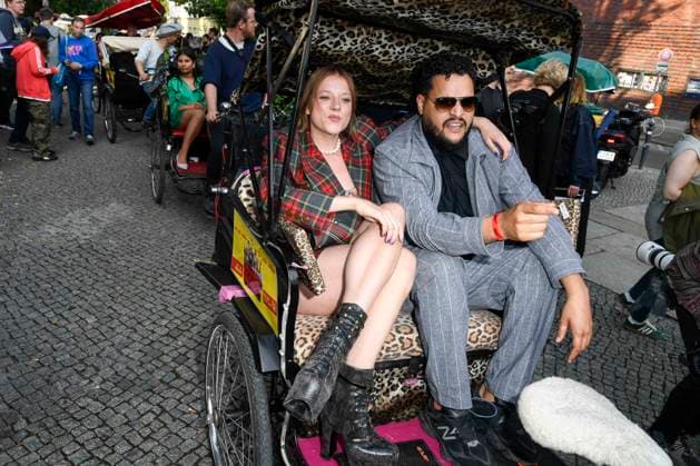abb Jella Haase and Yasin Harrouk actors sit in the bicycle rickshaw as guests at the premiere of the film SchwarzeSchafe at the cinema in the Kultur Brauerei on July 15, 2025 in Berlin Berlin Germany