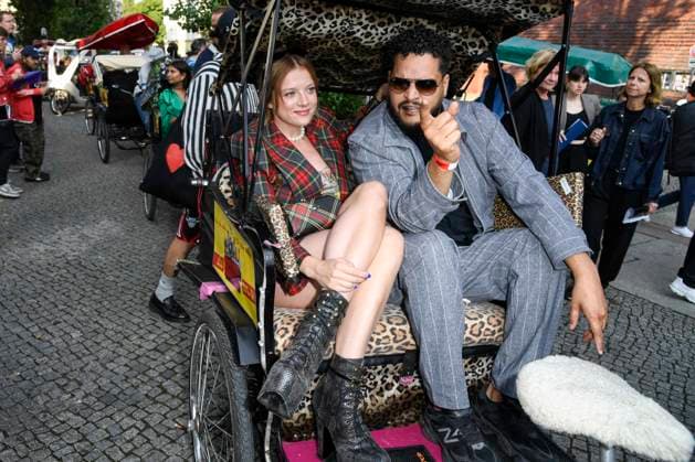 abb Jella Haase and Yasin Harrouk actors sit in the bicycle rickshaw as guests at the premiere of the film SchwarzeSchafe at the cinema in the Kultur Brauerei on July 15, 2025 in Berlin Berlin Germany