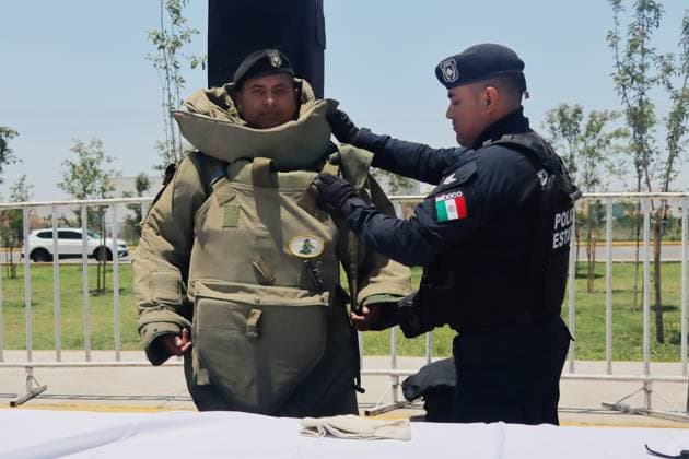 Unified Command East State of Mexico Ceremony A member of the State Police is helped by his colleague to put on a bomb suit during the start-up ceremony of the Unified Command East State of Mexico, at the Unidad Deportiva Ciudad Jardin. on July 16, 2025 in Nezahualcoyotl, Mexico. (Photo by Carlos Santiago Eyepix Group) Copyright: xCarlosxSantiagox xEyepixxGroupx CS_16072025_161754