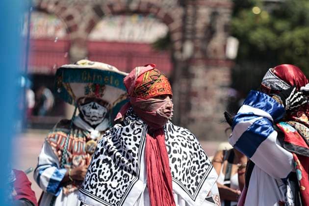 July 19, 2025, Chalco, State Of Mexico, Mexico: In the volcanic area, the celebration of SANTIAGO THE APOSTOLE, the patron saint of Chalco, State of Mexico, begins with the traditional Chinelos, native to Tlayacapan, Tepozotlan, and Yautepec, State of Morelos. These people dance through the streets wearing handmade costumes made with different fabrics, materials, paints, and masks. They originated during the colonial era to mock the Spanish, which is why their costumes have extravagant decorations and their masks resemble the faces, light skin, and colored eyes of the foreigners who invaded Mexico. The word Chinelo comes from the Nahuatl word meaning disguised Chalco Mexico - ZUMAp204 20250719_zip_p204_016 Copyright: xJosuexPerezx