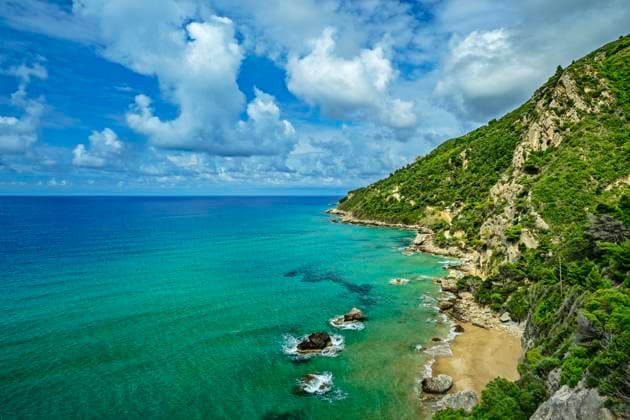 Scenic bay of Myrtiotissa on Corfu with turquoise sea and rocky coast, ANSF01511