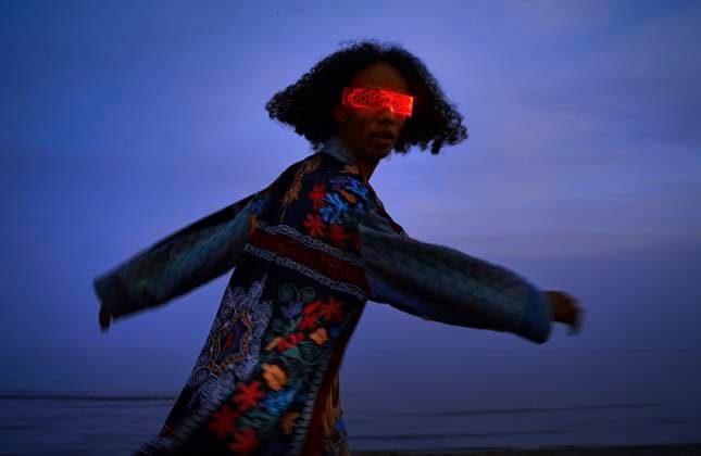 Creative Highlight Symbolbilder Person dancing outdoors in patchwork robe and VR glasses at dusk model released, Symbolfoto property released, AZF00692