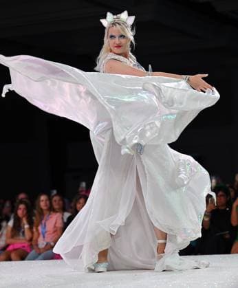 Designer Jennifer Biladeau wears her design entry as she walks down the runway at the 11th Annual Her Universe Fashion Show during Comic-Con at the Seaport Ballroom of the Manchester Grand Hyatt in San Diego, California on Thursday, July 24, 2025. The fan-favorite event showcases work from designers across the country competing for the opportunity to design an exclusive apparel collection with Her Universe.  SDI20250724132 CHRISxCHEW