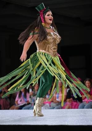 Designer Meredith Heika wears her design entry as she walks down the runway at the 11th Annual Her Universe Fashion Show during Comic-Con at the Seaport Ballroom of the Manchester Grand Hyatt in San Diego, California on Thursday, July 24, 2025. The fan-favorite event showcases work from designers across the country competing for the opportunity to design an exclusive apparel collection with Her Universe.  SDI20250724130 CHRISxCHEW
