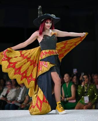 Designer Cat Gravereaux shows off her design entry as she walks down the runway at the 11th Annual Her Universe Fashion Show during Comic-Con at the Seaport Ballroom of the Manchester Grand Hyatt in San Diego, California on Thursday, July 24, 2025. The fan-favorite event showcases work from designers across the country competing for the opportunity to design an exclusive apparel collection with Her Universe.  SDI20250724131 CHRISxCHEW