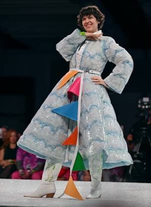 Designer Steph Piper wears her design entry as she walks down the runway at the 11th Annual Her Universe Fashion Show during Comic-Con at the Seaport Ballroom of the Manchester Grand Hyatt in San Diego, California on Thursday, July 24, 2025. The fan-favorite event showcases work from designers across the country competing for the opportunity to design an exclusive apparel collection with Her Universe.  SDI20250724135 CHRISxCHEW