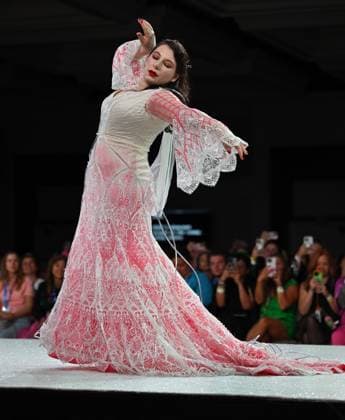 Designer Paige Campbell models her design entry on the runway at the 11th Annual Her Universe Fashion Show during Comic-Con at the Seaport Ballroom of the Manchester Grand Hyatt in San Diego, California on Thursday, July 24, 2025. The fan-favorite event showcases work from designers across the country competing for the opportunity to design an exclusive apparel collection with Her Universe.  SDI20250724140 CHRISxCHEW