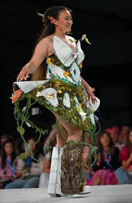 Designer Emma Joy wears her design entry I Am Wild as she walks down the runway at the 11th Annual Her Universe Fashion Show during Comic-Con at the Seaport Ballroom of the Manchester Grand Hyatt in San Diego, California on Thursday, July 24, 2025. The fan-favorite event showcases work from designers across the country competing for the opportunity to design an exclusive apparel collection with Her Universe.  SDI20250724141 CHRISxCHEW