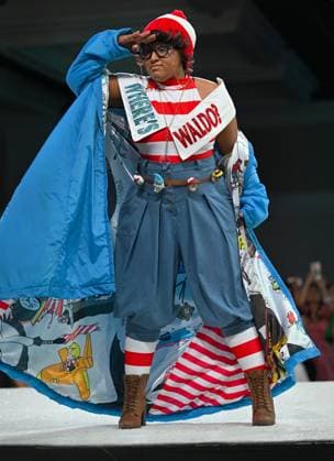 Designer Aaliyah Frye shows off her geek couture outfit as she walks down the runway at the 11th Annual Her Universe Fashion Show during Comic-Con at the Seaport Ballroom of the Manchester Grand Hyatt in San Diego, California on Thursday, July 24, 2025. The fan-favorite event showcases work from designers across the country competing for the opportunity to design an exclusive apparel collection with Her Universe.  SDI20250724142 CHRISxCHEW