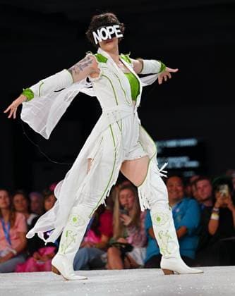 Designer Steph Piper shows off her outfit as she walks down the runway at the 11th Annual Her Universe Fashion Show during Comic-Con at the Seaport Ballroom of the Manchester Grand Hyatt in San Diego, California on Thursday, July 24, 2025. The fan-favorite event showcases work from designers across the country competing for the opportunity to design an exclusive apparel collection with Her Universe.  SDI20250724136 CHRISxCHEW