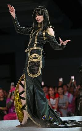 Designer Caitlin Beards wears her entry design as she walks down the runway at the 11th Annual Her Universe Fashion Show during Comic-Con at the Seaport Ballroom of the Manchester Grand Hyatt in San Diego, California on Thursday, July 24, 2025. The fan-favorite event showcases work from designers across the country competing for the opportunity to design an exclusive apparel collection with Her Universe.  SDI20250724146 CHRISxCHEW