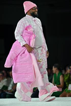 Designer Terence Johnson wears his design entry as he walks the runway at the 11th Annual Her Universe Fashion Show during Comic-Con at the Seaport Ballroom of the Manchester Grand Hyatt in San Diego, California on Thursday, July 24, 2025. The fan-favorite event showcases work from designers across the country competing for the opportunity to design an exclusive apparel collection with Her Universe.  SDI20250724150 CHRISxCHEW