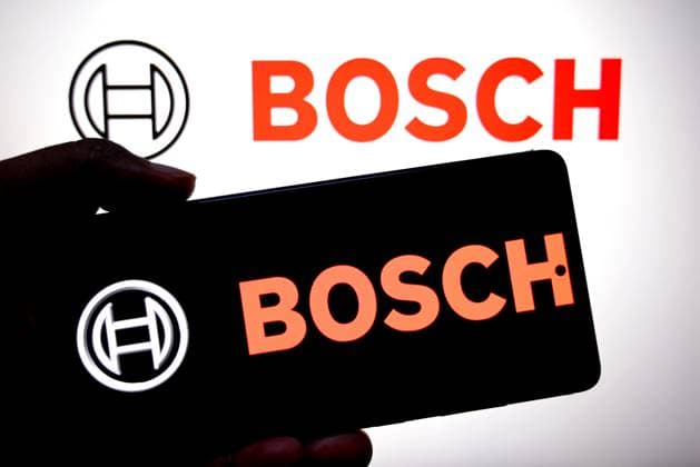 Illustration lot 11 in India - 25 Jul 2025 In this photo illustration, a Bosch logo is seen displayed on a smartphone and in the background. India Copyright: xAvishekxDasx xSOPAxImagesx avdtnmyjuly25lot11j