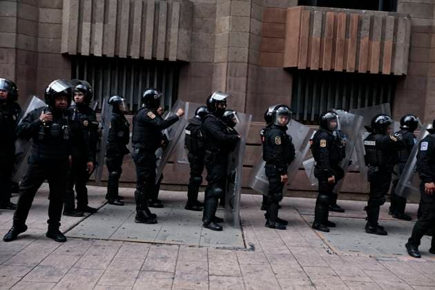 July 26, 2025, Mexico, Cdmx, Mexico: In light of the ongoing and apparently increasing gentrification in Mexico City, a small group of protesters gathered to march from the Hemiciclo a Juarez (Juarez City Hall) to the U.S. Embassy. Moments before the march began, they reversed course toward the city s Zocalo. Hundreds of police officers were deployed by the Ministry of Citizen Security to contain any attacks or damage caused by members of the Black Bloc. Mexico Mexico - ZUMAp204 20250726_zip_p204_026 Copyright: xJosuexPerezx