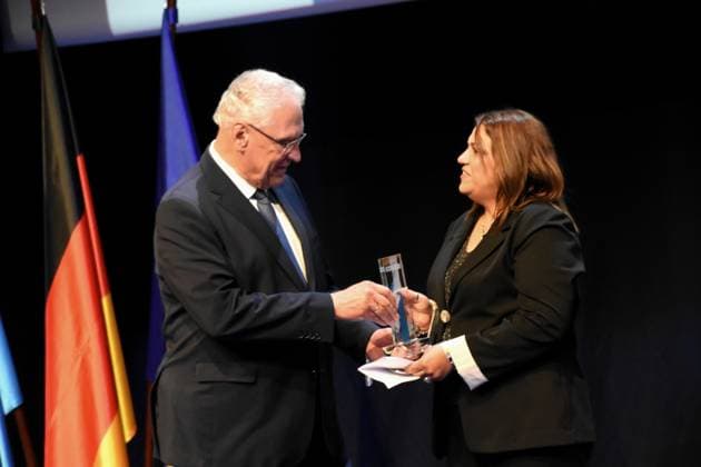 Joachim Herrmann Minister of the Interior Laudator with prizewinner Special Prize of the Minister of the Interior Mufida Khalil Interreligious Womens Breakfast under the Roof of the Bridge Koeprue Nuremberg Munich 26 07 2025 Auditorium of BMW Welt,Bavarias Minister of the Interior Joachim Herrmann awards the Bavarian Commitment Prize 2025 for extraordinary a