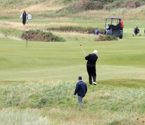 American President Donald Trump plays golf at Turnberry Golf Club, Ayrshire in Scotland on Sunday, July 27, 2025. Trump is on a four day visit to Scotland where he will be playing golf and meeting International leaders for trade discussions.  LON2025072714 HUGOxPHILPOTT