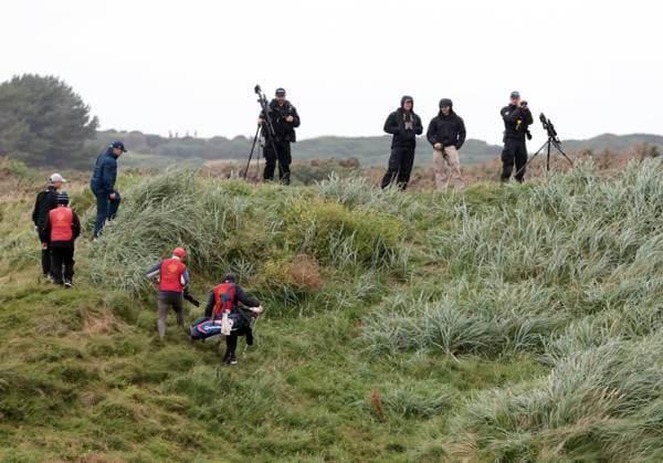 Golfers look for their ball with armed snipers looking down at them before American President s arrival at Turnberry Golf Club, Ayrshire in Scotland on Sunday, July 27, 2025. Trump is on a four day visit to Scotland where he will be playing golf and meeting International leaders for trade discussions.  LON2025072725 HUGOxPHILPOTT