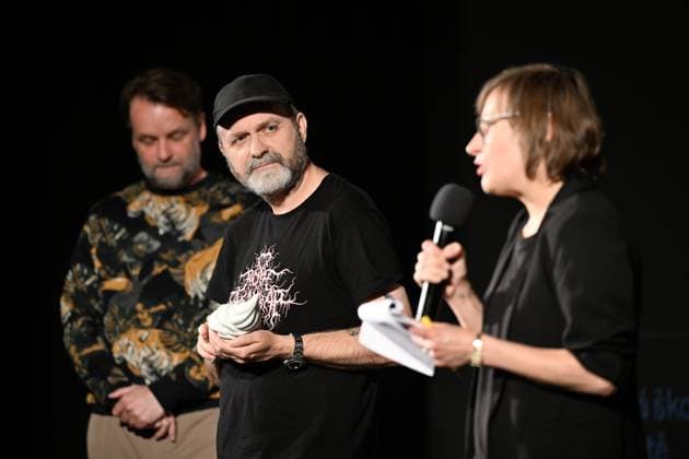 Lukas Moodysson, Swedish poet, novelist, film director and non-conformist, one of the most prominent personalities of the local culture in general, receives the ACFK Annual Award within the 51st Summer Film School in Uherske Hradiste, Czech Republic, July 27, 2025. On the left is programme director Jan Jilek and right translator Bara Stefanova. (CTKxPhoto DaliborxGluck) CTKPhotoP2025072705407  CTKPhotoP2025072705407