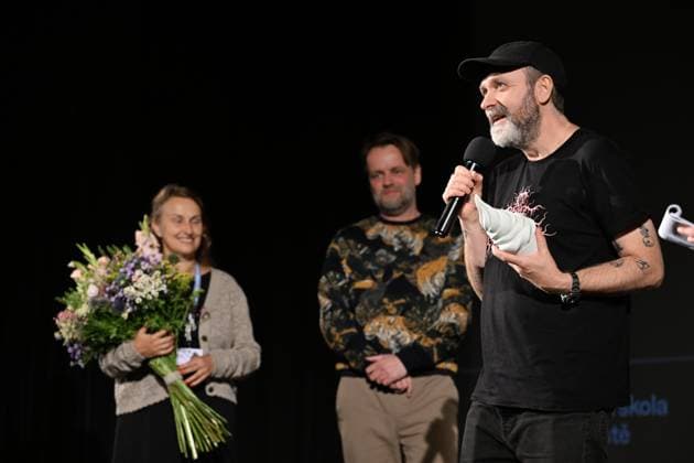 Lukas Moodysson, Swedish poet, novelist, film director and non-conformist, one of the most prominent personalities of the local culture in general, receives the ACFK Annual Award within the 51st Summer Film School in Uherske Hradiste, Czech Republic, July 27, 2025. From left: festival director Radana Korena, programme director Jan Jilek and director Lukas Moodysson. (CTKxPhoto DaliborxGluck) CTKPhotoP2025072705412  CTKPhotoP2025072705412