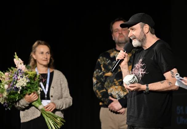 Lukas Moodysson, Swedish poet, novelist, film director and non-conformist, one of the most prominent personalities of the local culture in general, receives the ACFK Annual Award within the 51st Summer Film School in Uherske Hradiste, Czech Republic, July 27, 2025. From left: festival director Radana Korena, programme director Jan Jilek and director Lukas Moodysson. (CTKxPhoto DaliborxGluck) CTKPhotoP2025072705414  CTKPhotoP2025072705414