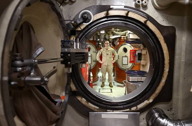 USS OHIO BRISBANE VISIT, A crew member is seen in the missile compartment aboard the USS Ohio, the first Ohio-class submarine to pull into the Port of Brisbane, Wednesday, July 30, 2025. The USS Ohio which is a nuclear-powered guided-missile submarine with 150 crew is visiting Brisbane. ( NO ARCHIVING BRISBANE QLD AUSTRALIA  Copyright: xDARRENxENGLANDx 20250730198686595123