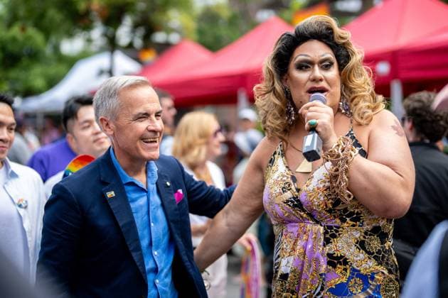 August 3, 2025, Vancouver, Bc, CANADA: p>Prime Minister Mark Carney speaks with a drag performer during the Vancouver Pride Parade in Vancouver, on Sunday, August 3, 2025. Vancouver CANADA  - ZUMAc35_ 20250803_zaf_c35_155 Copyright: xEthanxCairnsx