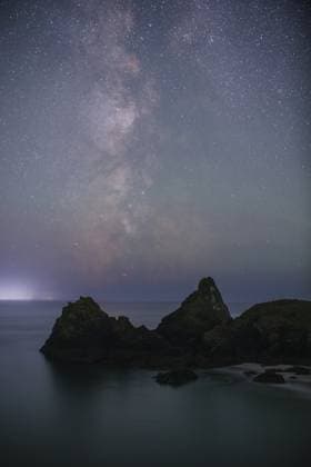 Spectacular view captured by hobby photographer as two wonders of nature appear at same time Story from Jam Press (Two Natural Wonders) Pictured: The Milky Way spotted at Kynance on the Lizard peninsula in Cornwall. Spectacular view captured by hobby photographer as two wonders of nature appear at same time Two wonders of nature have been caught on camera at the same time. Thomas Winstone snapped a stunning blue glow in the sea beneath the beautiful Milky Way. The eerie light was being emitted by plankton that had been churned up by the waves. Firefighter Mr Winstone was visiting Cornwall to photograph the night sky when he witnessed the shining water at Kynance on the Lizard peninsula. I only went one night to see the Milky Way, M  Copyright: xJamxPress ThomasxWinstone