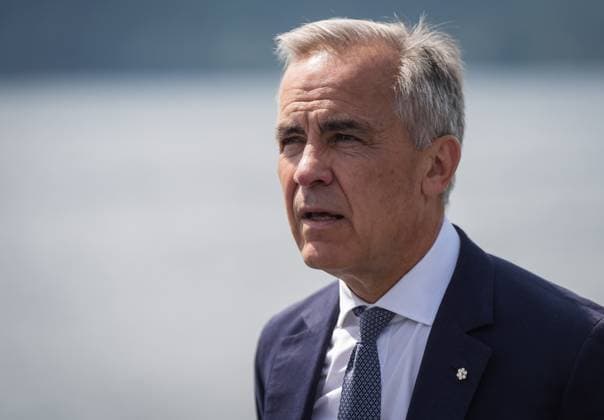 August 4, 2025, Nanoose Bay, Bc, CANADA: Prime Minister Mark Carney listens while touring the Royal Canadian Navy torpedo recovery vessel Sikanni at the Canadian Forces Maritime Experimental and Test Ranges (CFMETR), in Nanoose Bay, B.C.,, on Monday, August 4, 2025. Nanoose Bay CANADA - ZUMAc35_ 20250804_zaf_c35_044 Copyright: xDarrylxDyckx