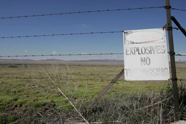 Utah: US Nuclear Waste Dumping Ground Mar 25, 2005; Skull Valley, UT, USA; Skull Valley is on the Goshute Indian Reservation in north-western Utah. Nestled between two ranges of snow-capped mountains, the valley is adjacent to Dugway, the US Army Proving Grounds for Chemical and Biological Weapons. On the reservation, the Tekio Test Range warns of explosives and is visited by weapons treaty experts. And soon, Private Fuel Storage LLC, may be building a facility for the temporary (40 years) storage of radioactive waste from nuclear reactors throughout the US. The Tekio Test Range is just a few miles from the proposed location of the radioactive waste site. Skull Valley UT USA Copyright: xMikexFoxx