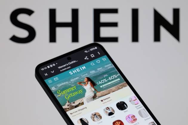 Shein - Photo Illustration The Shein online store is displayed on a mobile phone with Shein seen in the background in Brussels, Belgium, on August 4, 2025. Brussels Belgium  Copyright: xJonathanxRaax originalFilename: raa-sheinpho250804_npHZy.jpg