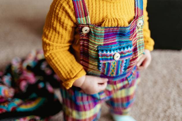 Creative Highlights Symbolbilder Close up of colorful toddler overalls Painesdale, Michigan, United States R_OAXI250805-1796250-01 ,model released, Symbolfoto
