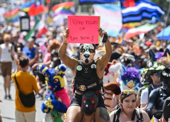 August 10, 2025, Montreal, Pq, Canada: A person holds up a sign during the Pride parade in Montreal, Sunday, August 10, 2025. Montreal Canada  - ZUMAc35_ 20250810_zaf_c35_010 Copyright: xGrahamxHughesx
